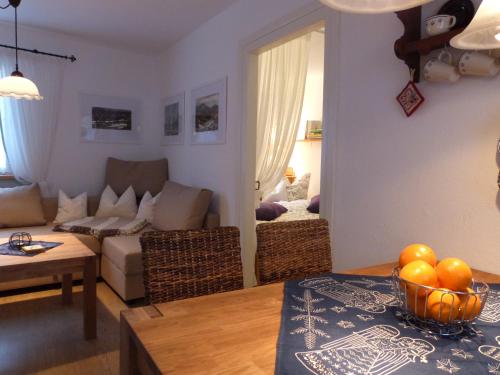 a living room with a couch and a table at Ferienhäusel am Malerweg mit Terrasse in Bad Schandau