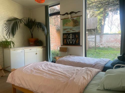 Ένα ή περισσότερα κρεβάτια σε δωμάτιο στο Spacious house with big garden close to the city
