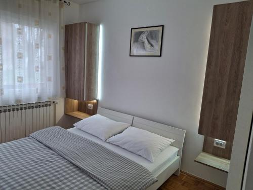 Posteľ alebo postele v izbe v ubytovaní Guest House Kosec