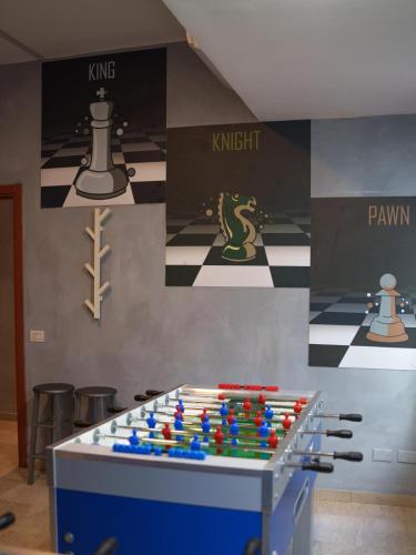 a room with a table with chess pieces on it at Lion University & Youth Hostel Milano in Milan