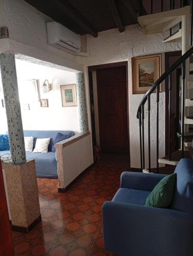 a living room with two beds and a couch at Casa RMF alla Fontana in Valsolda