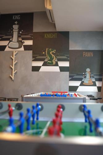 a room with chess pieces and a chess board at Lion University & Youth Hostel Milano in Milan