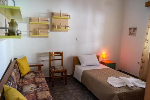 Ένα ή περισσότερα κρεβάτια σε δωμάτιο στο Emilia's Guest House