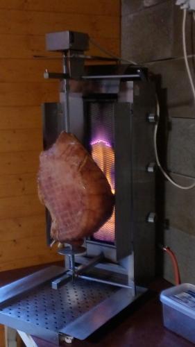 a piece of meat is being cooked in an oven at Apalucha119 in Ludvíkov