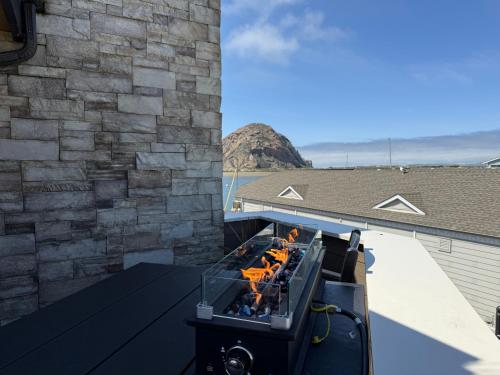 a boat sitting on top of a building at HarborWalk Inn in Morro Bay