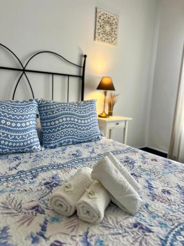 Hostal El Faroにあるベッド