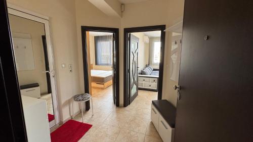 a room with a bathroom with a bed and a mirror at Apartment near Vitosha mountain, self check-in, with underground parking in Sofia