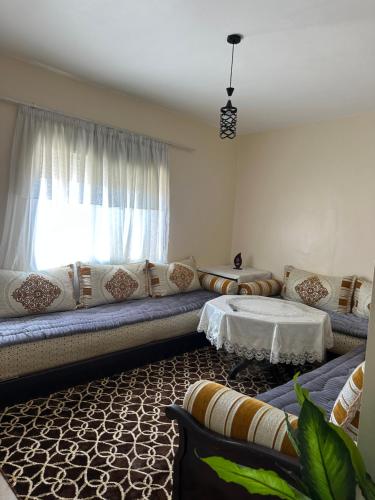 Ένα ή περισσότερα κρεβάτια σε δωμάτιο στο Residence afoulki 2 hay mohammadi