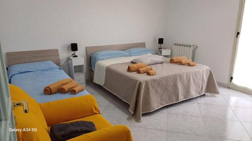 Postel nebo postele na pokoji v ubytování Casa Vacanze AML