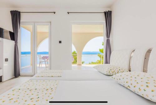 Ένα ή περισσότερα κρεβάτια σε δωμάτιο στο Ivana Black & White Apartments - Marusici