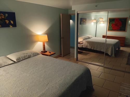 Ένα ή περισσότερα κρεβάτια σε δωμάτιο στο Diamond Head Beach Hotel