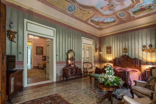 a living room with a painting on the ceiling at Le Porte del Tempo in Mazara del Vallo