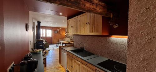 a kitchen with a sink and a counter top at La Frisanfave, Maison de village, centre 65M2 in Abriès