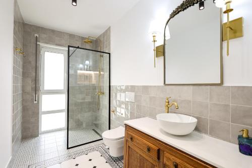 a bathroom with a toilet and a sink and a shower at SanPietro Vacation Apartments in Durrës