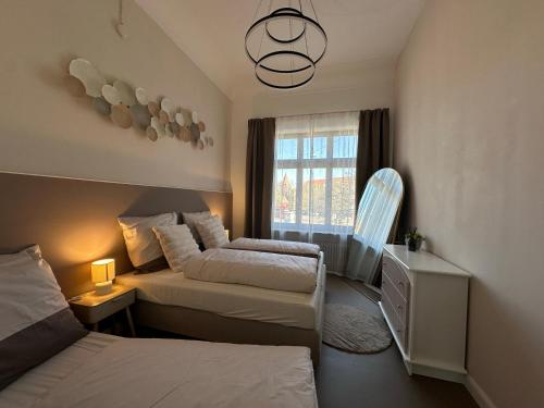 Ένα ή περισσότερα κρεβάτια σε δωμάτιο στο Villa Rosenau in Herzens Nürnberg