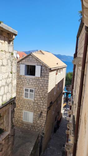 a building with a window on top of it at Korčula Old Town MARIJA Apartment in Korčula