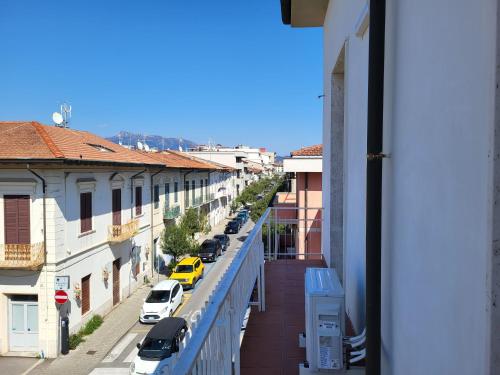 a view of a city street with cars parked on a balcony at A due passi dal mare Lovely Apartment Viareggio in Viareggio