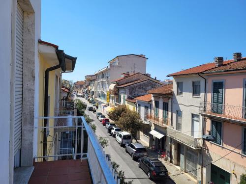 a city street with cars parked on a balcony at A due passi dal mare Lovely Apartment Viareggio in Viareggio