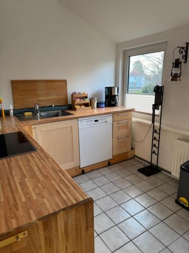 a kitchen with a sink and a counter top at GraueMaus in Asendorf