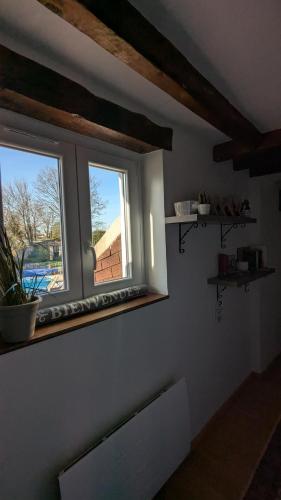 a window in a room with a view of a house at La Briarde triple PDJ in Boissy-le-Châtel