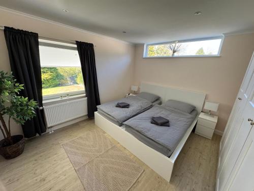 Postel nebo postele na pokoji v ubytování Ferienhaus Maja