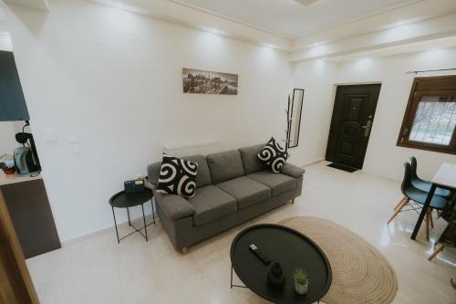 a living room with a couch and a table at Panorama Apartment in Kozani