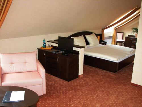 En eller flere senger på et rom på Hotel Restaurant Bootshaus