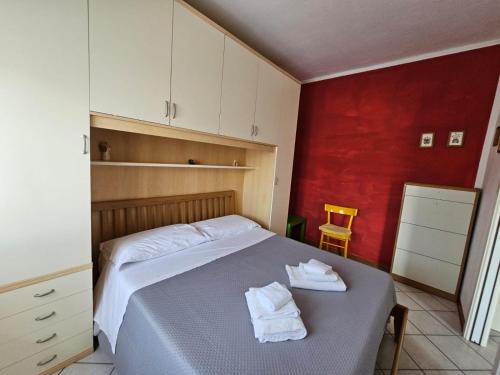 Ένα ή περισσότερα κρεβάτια σε δωμάτιο στο Il Castelluccio residence