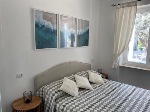 a bedroom with a bed with two pillows on it at Villa Claudia in Anacapri