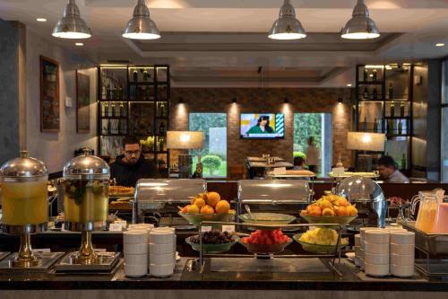 a buffet line with food on display in a restaurant at Casa Andina Select Tacna in Tacna