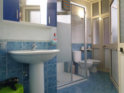 a bathroom with a sink and a toilet at Risorgimento House in Catania