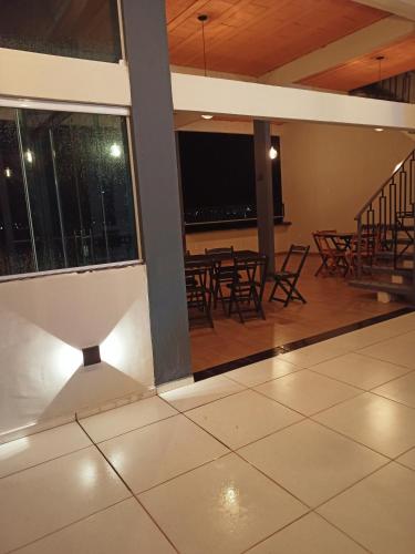 a view of a room with tables and chairs at NORTE HOTEL Guaraciaba in Inhussu
