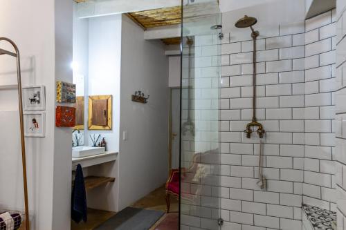 a bathroom with a shower and a sink at Art Box in Greyton