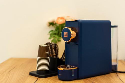 a blue suitcase sitting on top of a wooden table at Urban Beach Sirena in Francavilla al Mare