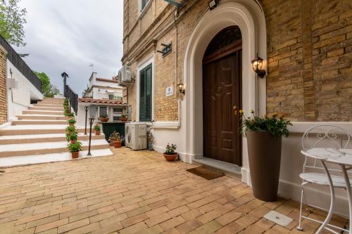 a front door of a house with a patio at Urban Beach Sirena in Francavilla al Mare