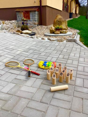 a group of toys sitting on a patio at Apartmány Ořechovka Wellness in Turnov
