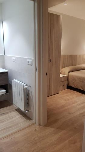 Ένα ή περισσότερα κρεβάτια σε δωμάτιο στο Apartament BEDOLL de Molló Parc