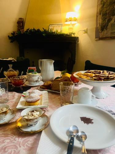 a table with plates of food on top of it at Le Terrazze Sul Pollino B&B in Civita