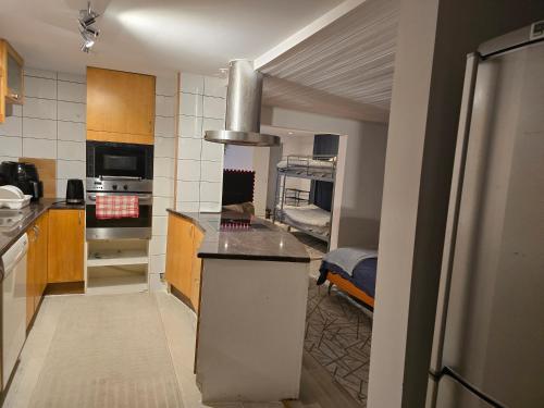a kitchen with a sink and a stove top oven at Relax Place in Svalöv