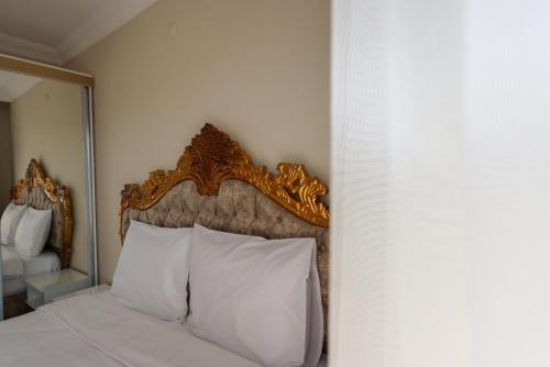 Katil atau katil-katil dalam bilik di Kılıçaslan Suite Hotel