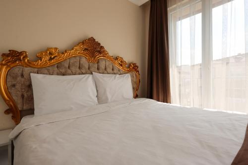 Katil atau katil-katil dalam bilik di Kılıçaslan Suite Hotel