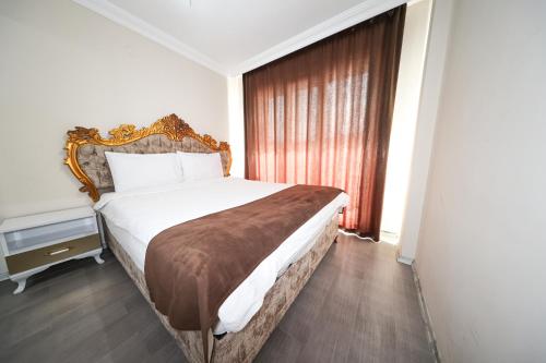 Katil atau katil-katil dalam bilik di Kılıçaslan Suite Hotel
