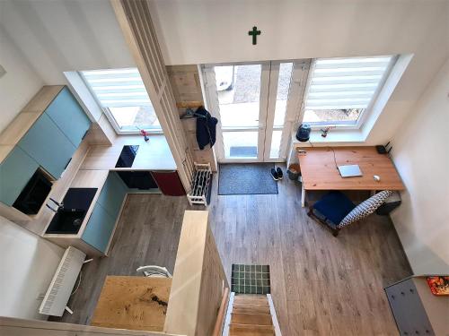 an overhead view of a room with a desk and a cross at Belvárosi Menedék in Nyíregyháza