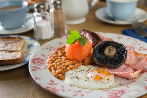 a plate of breakfast food on a table at Rashleigh Arms in St Austell