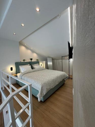 a bedroom with a bed and a ladder in it at Arches House Kavala private Parking in Kavala