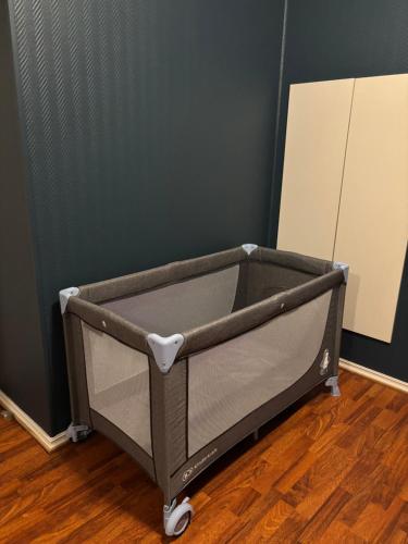 a gray cart sitting on the floor in a room at Brygga i Helgeroa in Larvik
