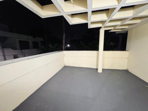 a view of an empty balcony at night at BougainVilla in Trivandrum