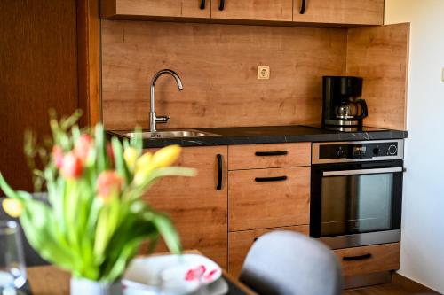 a kitchen with a sink and a stove at Countryside house in Male Brusnice