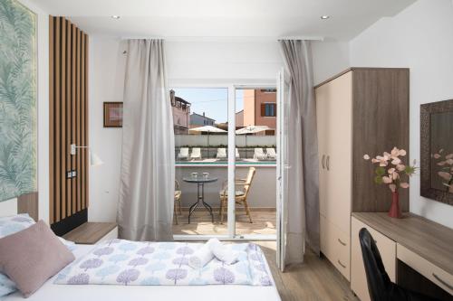 Ένα ή περισσότερα κρεβάτια σε δωμάτιο στο Apartmant & rooms Villa Rosa Medulin