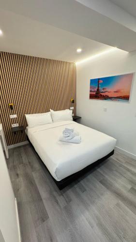 a bedroom with a large white bed in it at JACUZZI ROOMS Atocha in Madrid